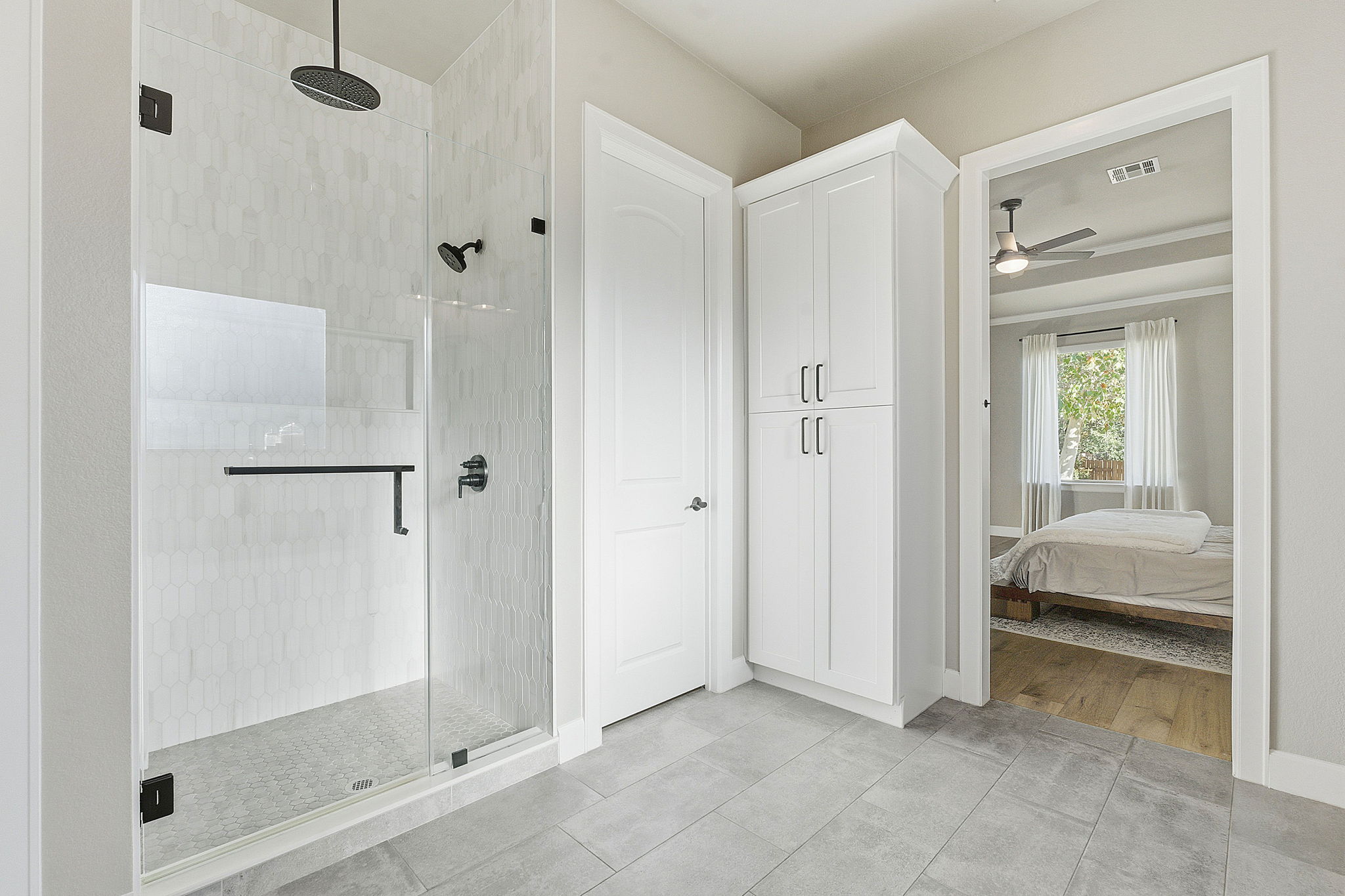 512 Choke Canyon Lane Georgetown, TX 78628 - Photo 17 of 37 Bathroom featuring ensuite bath, a stall shower, light tile patterned flooring, and a ceiling fan