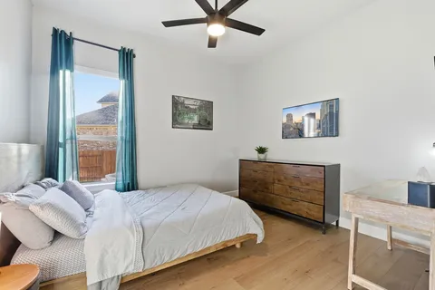 a bedroom with a bed and a window