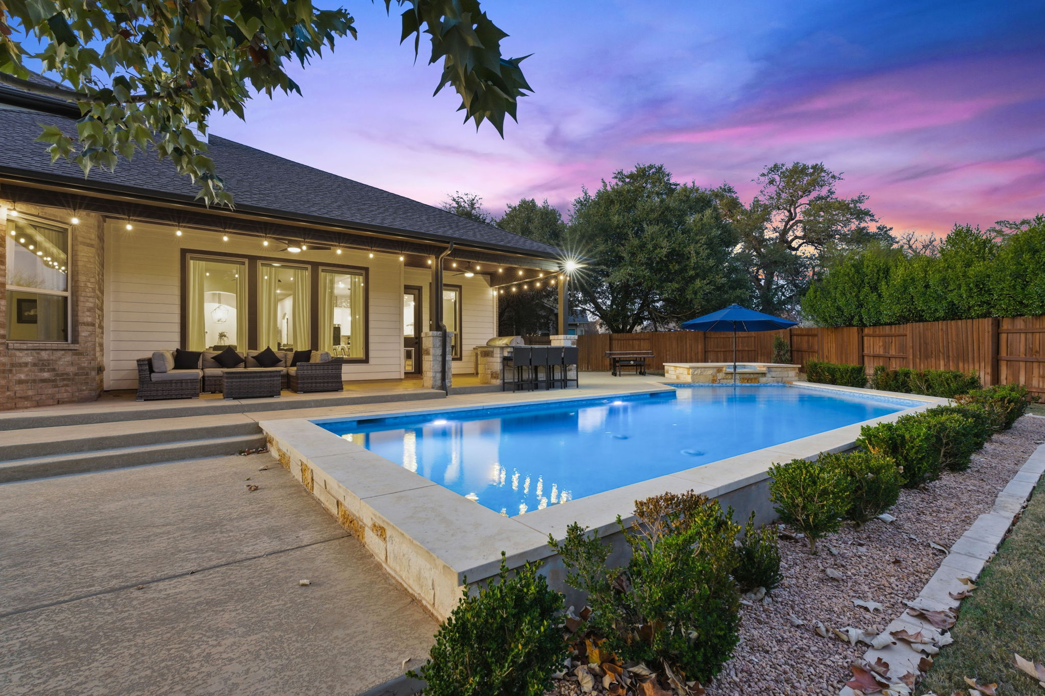512 Choke Canyon Lane Georgetown, TX 78628 - Photo 31 of 37 View of pool featuring a fenced backyard, an outdoor hangout area, a patio area, exterior kitchen, and a pool with connected hot tub