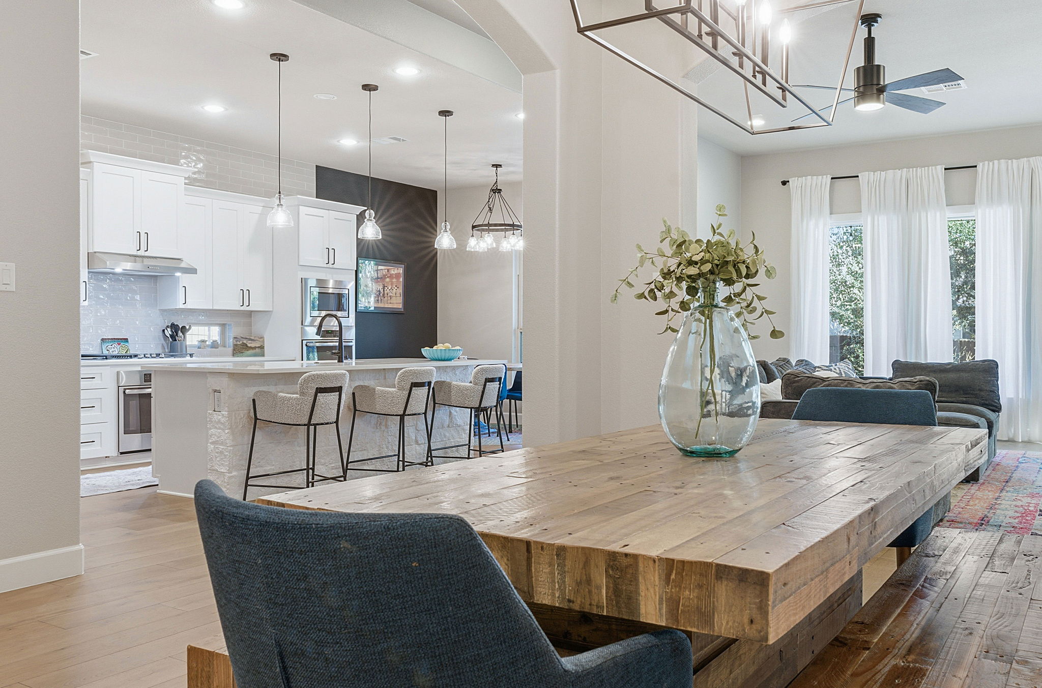 512 Choke Canyon Lane Georgetown, TX 78628 - Photo 6 of 37 Dining room featuring light wood-style flooring, recessed lighting, a ceiling fan, and a chandelier