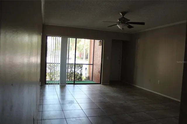 a view of an empty room with a window
