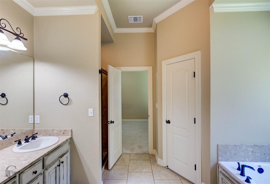 830 Entrada Bossier City, LA 71111 - Photo 12 of 25 a bathroom with a sink and a mirror