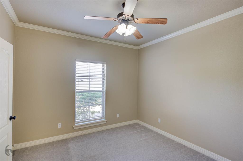 830 Entrada Bossier City, LA 71111 - Photo 16 of 25 an empty room with windows and chandelier fan