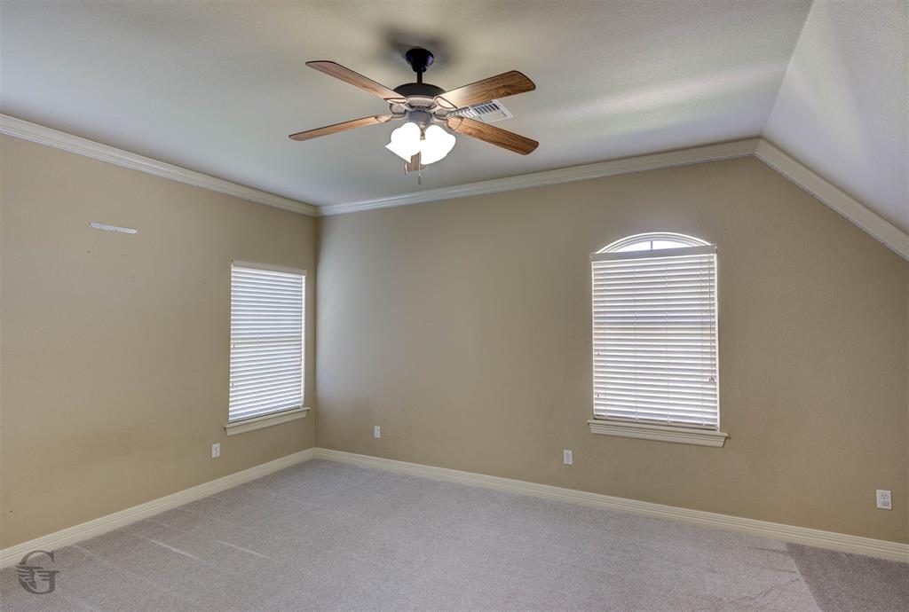 830 Entrada Bossier City, LA 71111 - Photo 19 of 25 an empty room with windows and fan