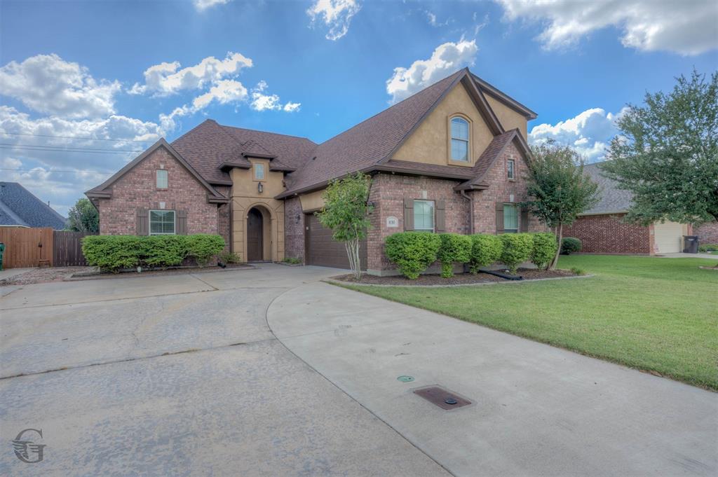 830 Entrada Bossier City, LA 71111 - Photo 2 of 25 a front view of a house with a yard and garage