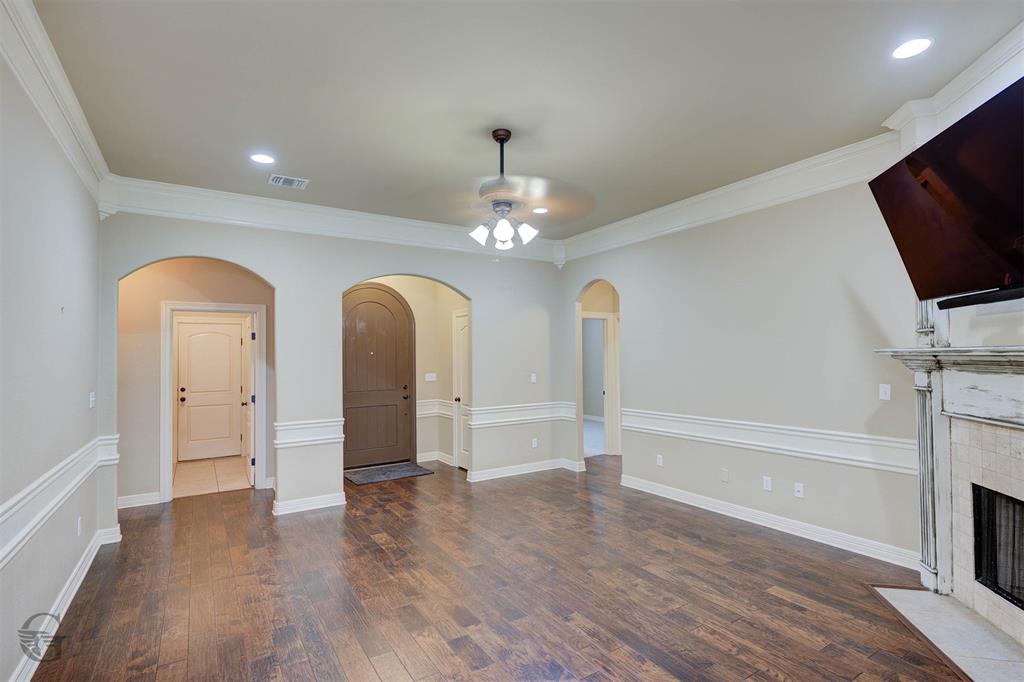 830 Entrada Bossier City, LA 71111 - Photo 5 of 25 a view of empty room with wooden floor and fireplace