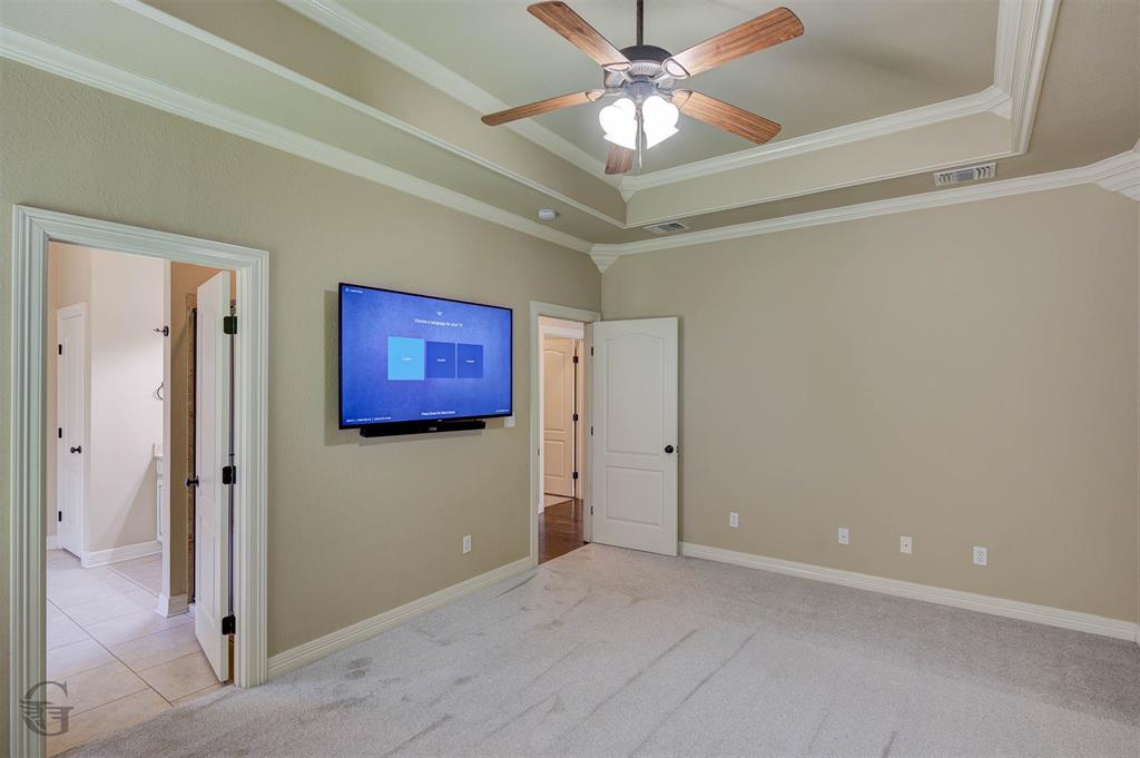 830 Entrada Bossier City, LA 71111 - Photo 9 of 25 a view of a hallway with a chandelier fan and windows