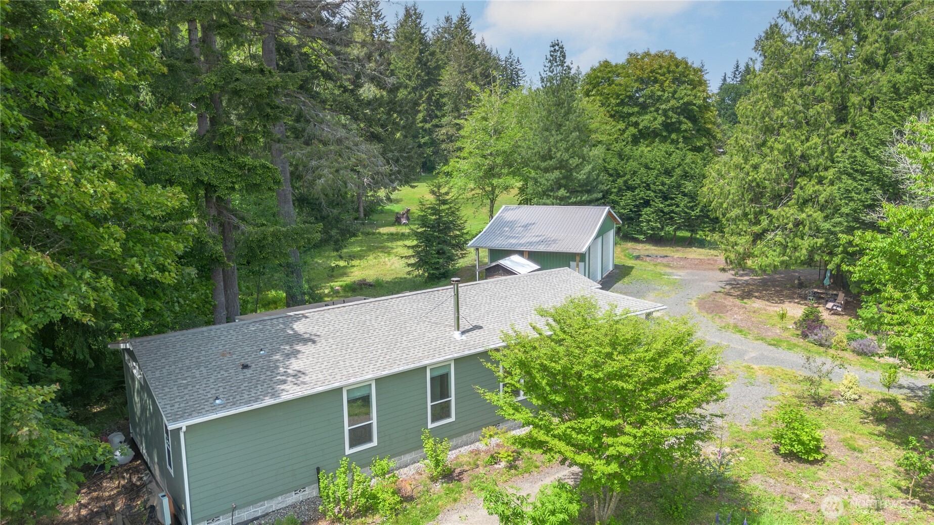 290 Werner Road Port Ludlow, WA 98365 - Photo 32 of 40 an aerial view of a house with yard and outdoor seating