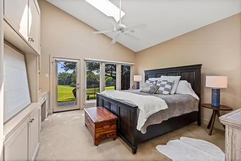 a bed room with a bed and a chandelier