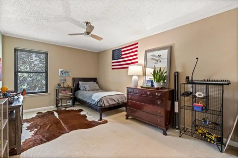 a bedroom with furniture and a window