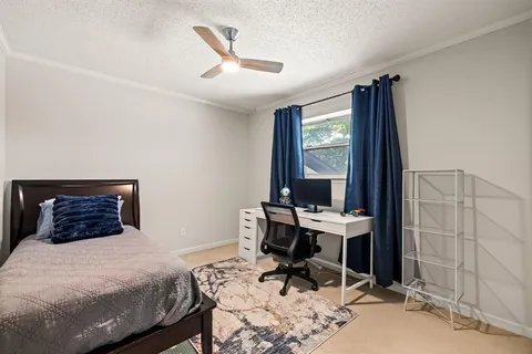 a bedroom with a bed and a table in it