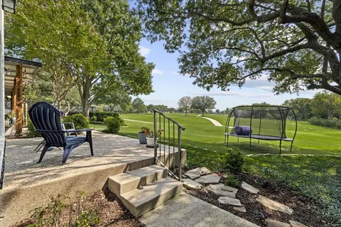 a view of a garden with patio