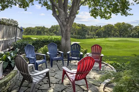 a view of a chairs and table in the garden