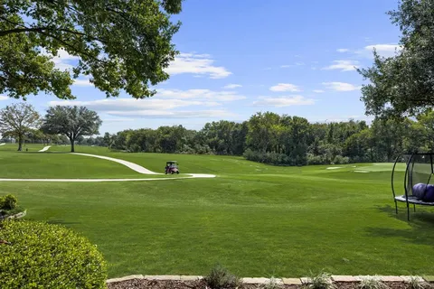 a view of a big yard with green space