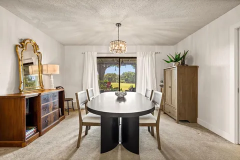 a dining room with furniture window wooden floor