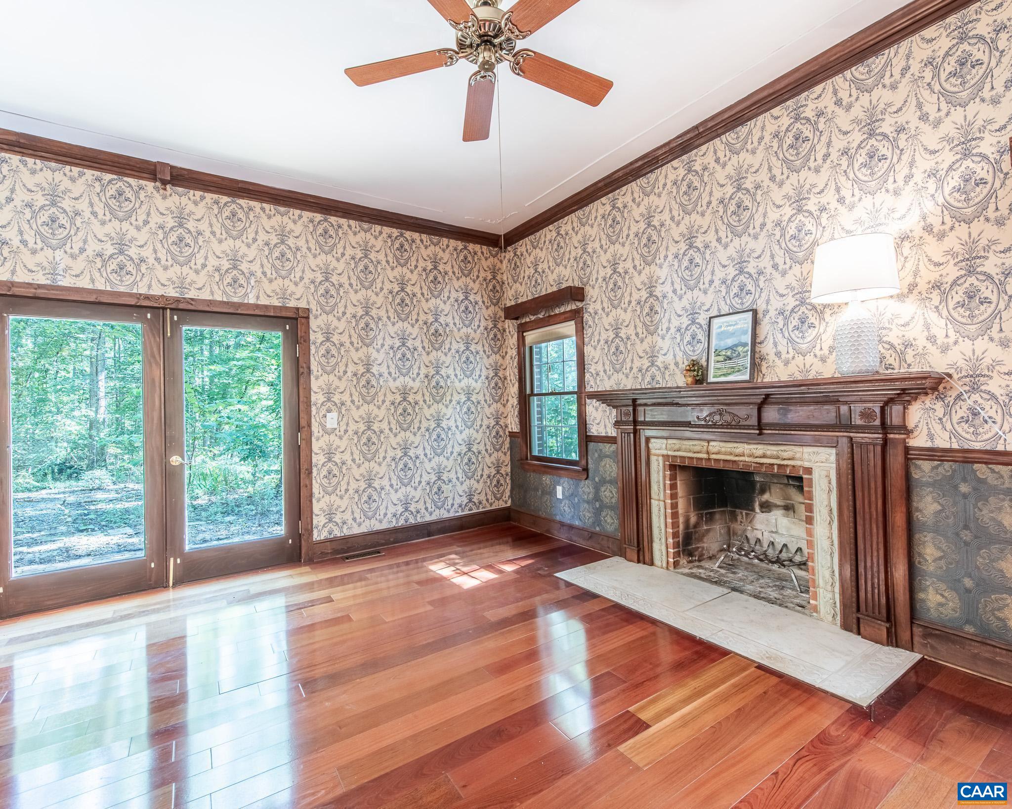 87 Retriever Ridge Drive Gordonsville, VA 22942 - Photo 17 of 41 a view of an empty room with wooden floor fireplace and a window