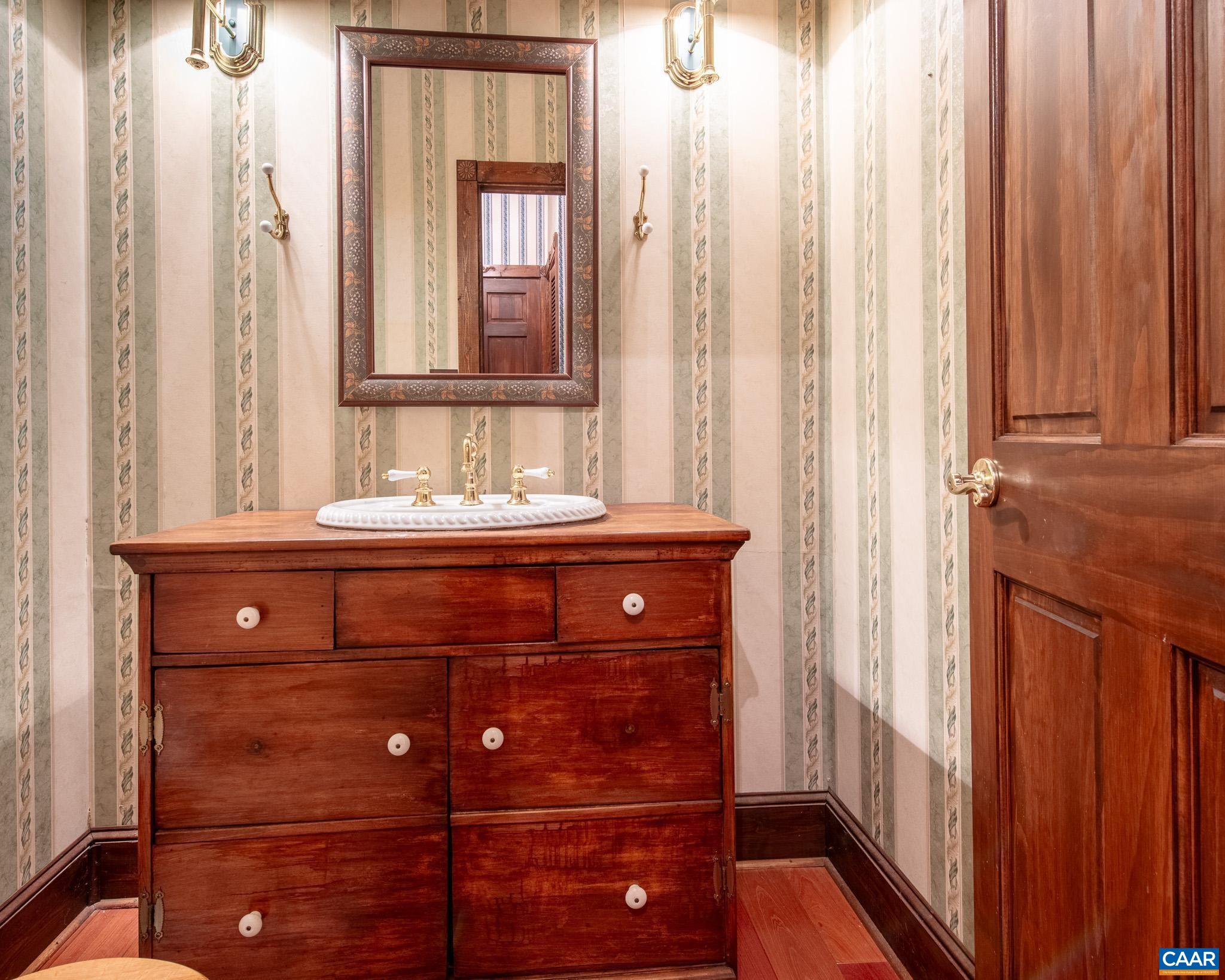 87 Retriever Ridge Drive Gordonsville, VA 22942 - Photo 21 of 41 a bathroom with a sink and a mirror