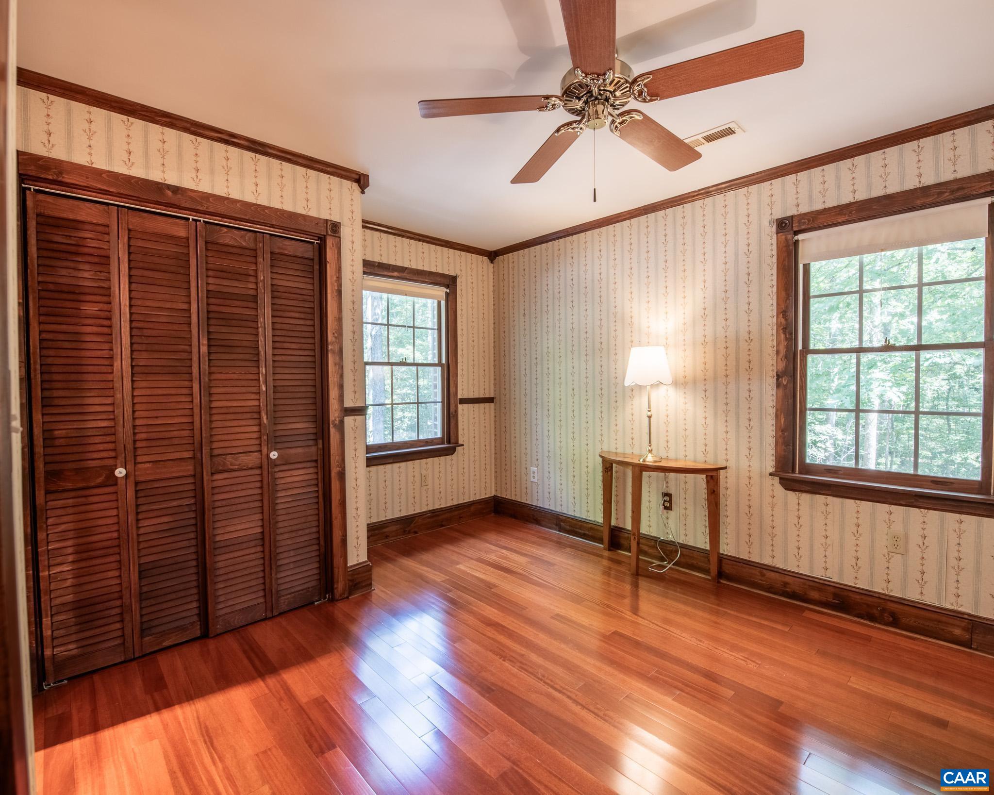 87 Retriever Ridge Drive Gordonsville, VA 22942 - Photo 25 of 41 an empty room with wooden floor and windows