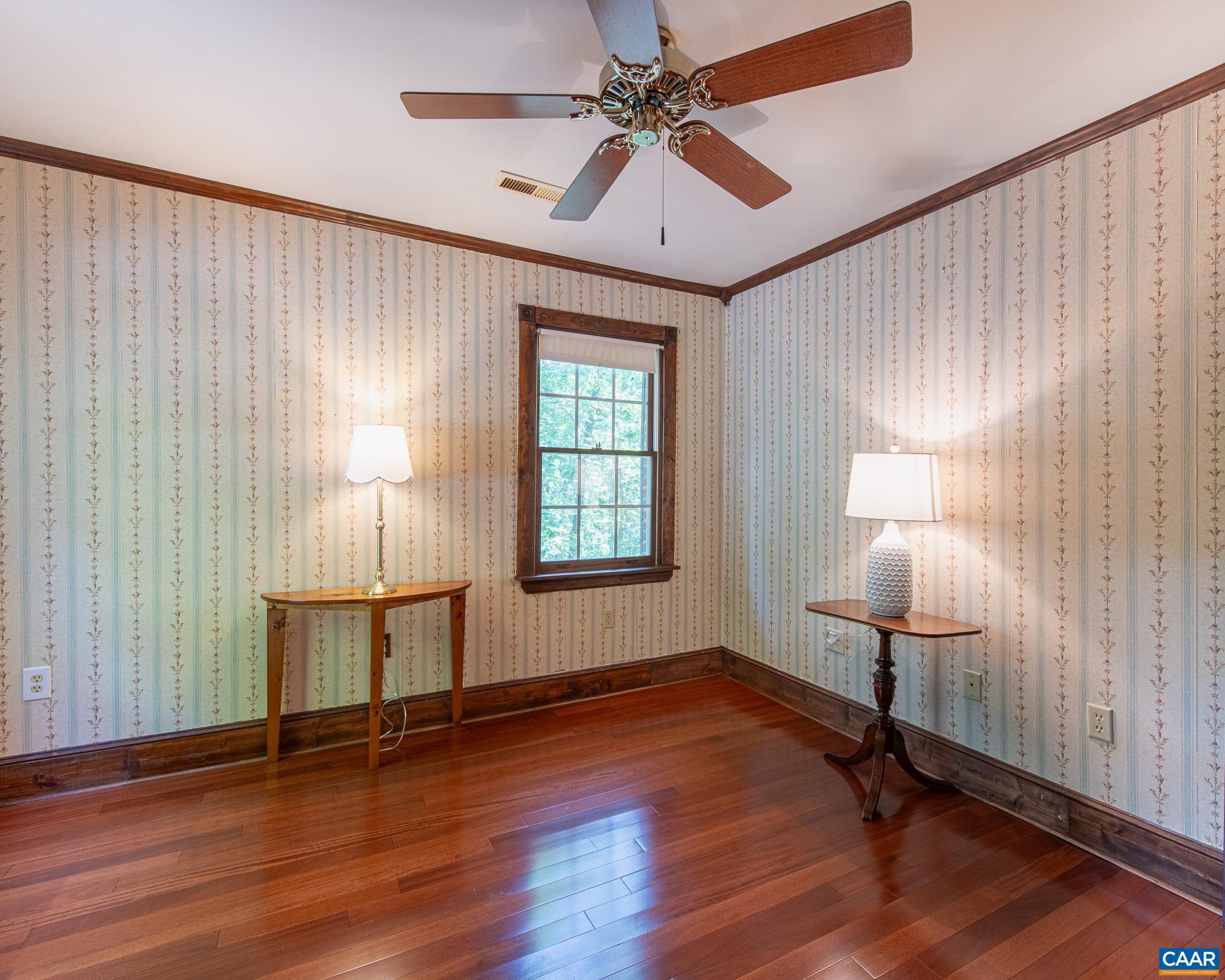 87 Retriever Ridge Drive Gordonsville, VA 22942 - Photo 27 of 41 a view of an empty room with a window and wooden floor