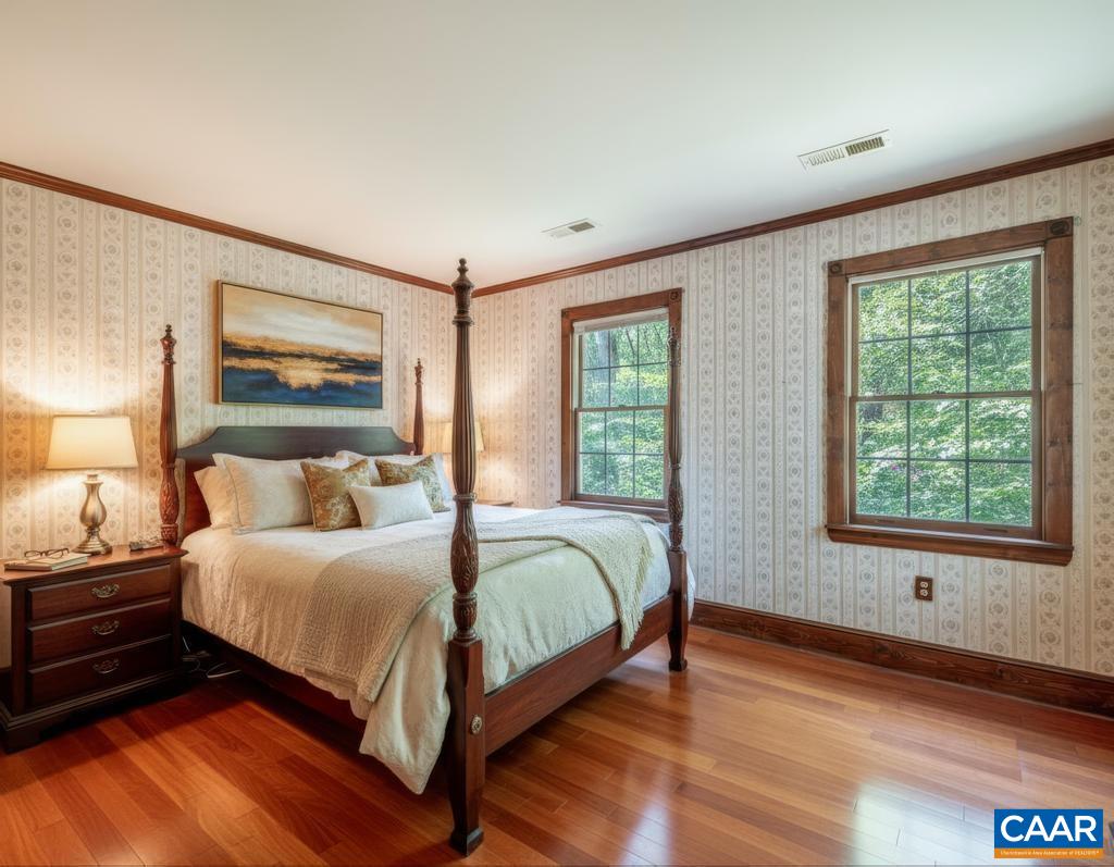 87 Retriever Ridge Drive Gordonsville, VA 22942 - Photo 33 of 41 a bedroom with a bed and wooden floor