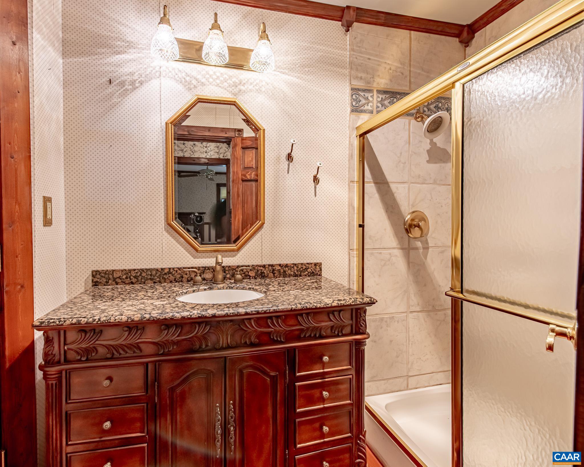 87 Retriever Ridge Drive Gordonsville, VA 22942 - Photo 37 of 41 a bathroom with a sink and a mirror