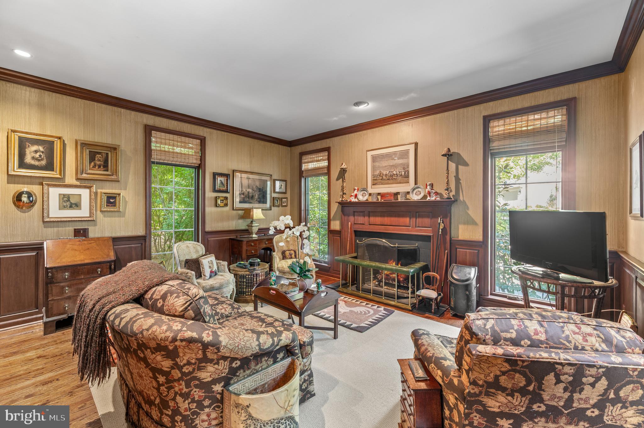 1236 Denbigh Lane Wayne, PA 19087 - Photo 13 of 36 a living room with fireplace furniture and a flat screen tv