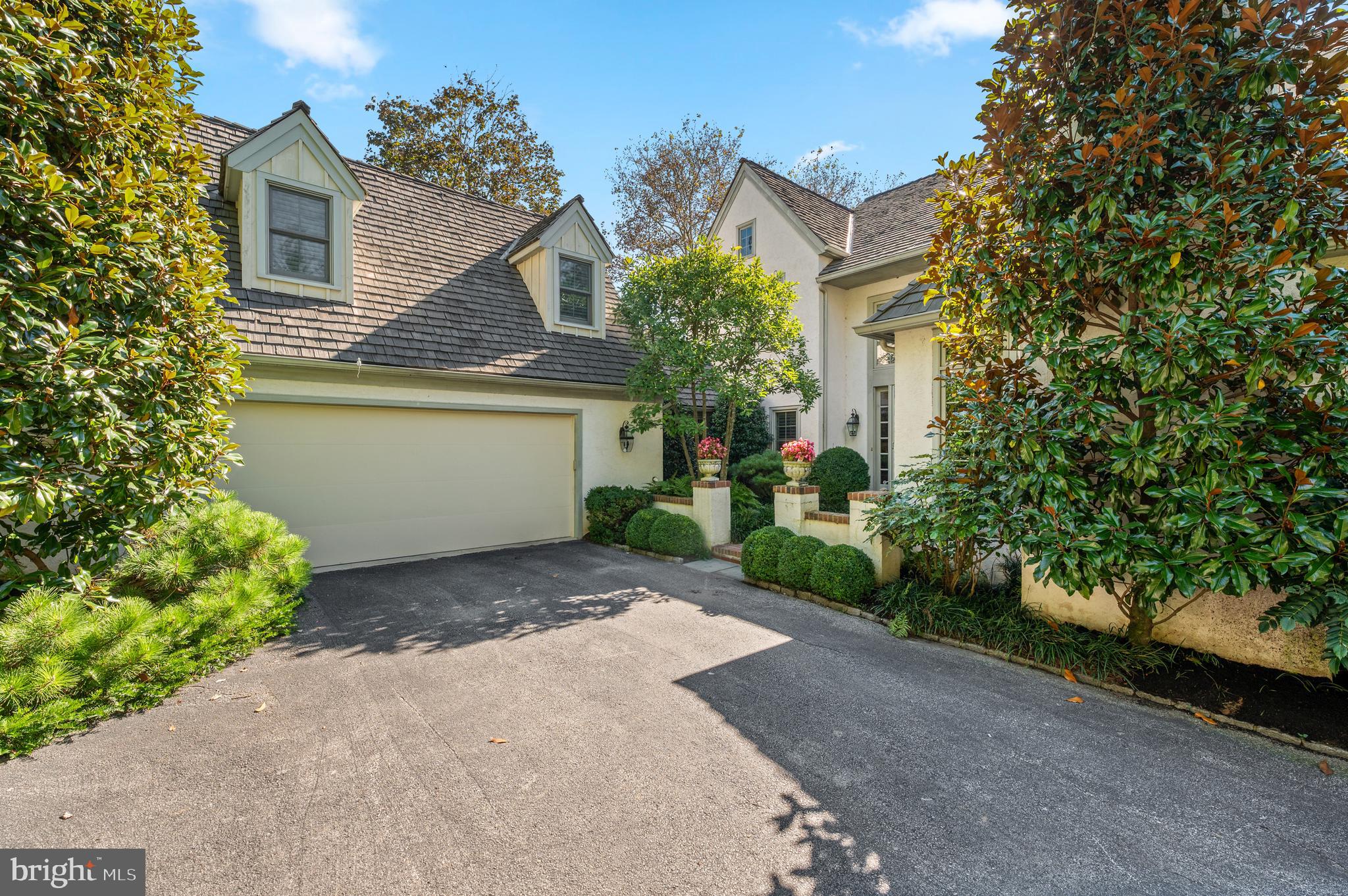 1236 Denbigh Lane Wayne, PA 19087 - Photo 2 of 36 a front view of a house with a yard and a garage