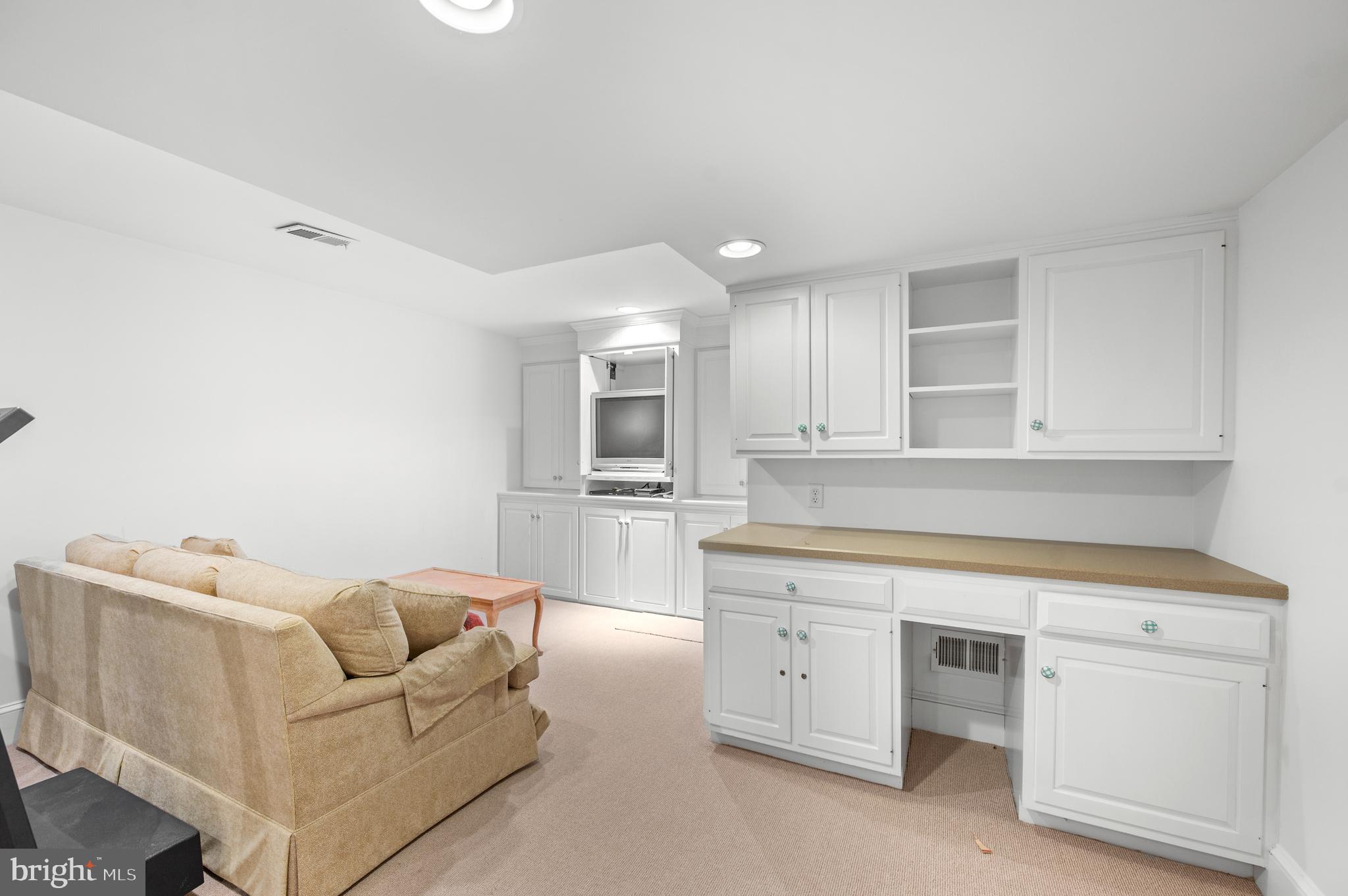 1236 Denbigh Lane Wayne, PA 19087 - Photo 31 of 36 a living room with white cabinets and white appliances