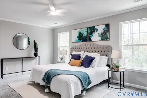 a bedroom with a large bed and a window