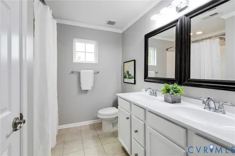 a bathroom with a bath tub with a shower