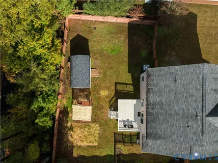 a view of a wooden deck and a yard