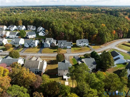 an aerial view of a house with a garden