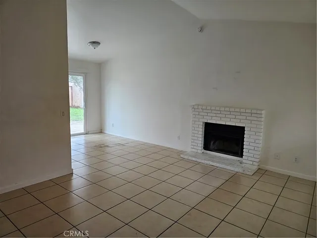 an empty room with a fireplace