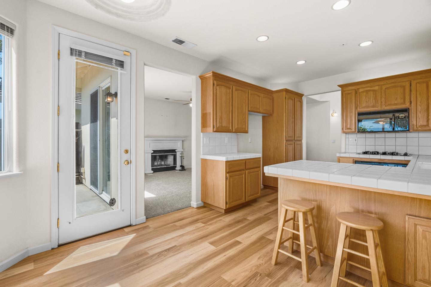 215 Montclair Lane Salinas, CA 93906 - Photo 13 of 40 a kitchen with a sink and refrigerator