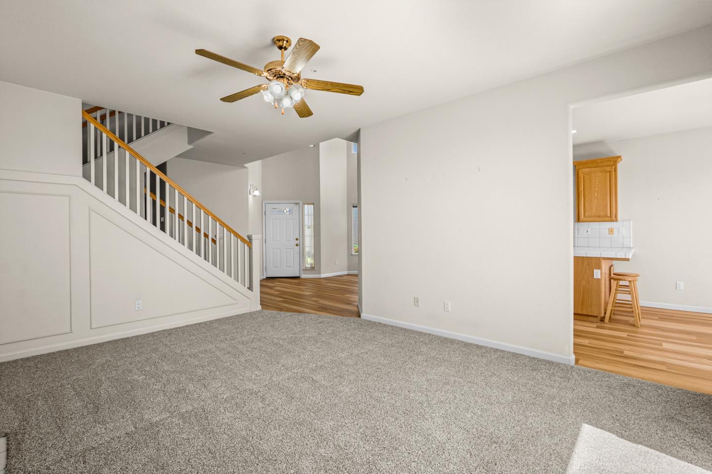 215 Montclair Lane Salinas, CA 93906 - Photo 16 of 40 a view of an empty room with wooden floor and a ceiling fan