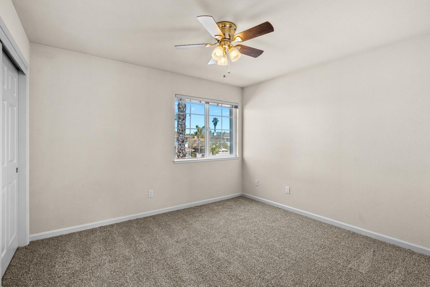 215 Montclair Lane Salinas, CA 93906 - Photo 27 of 40 an empty room with a window and a fan