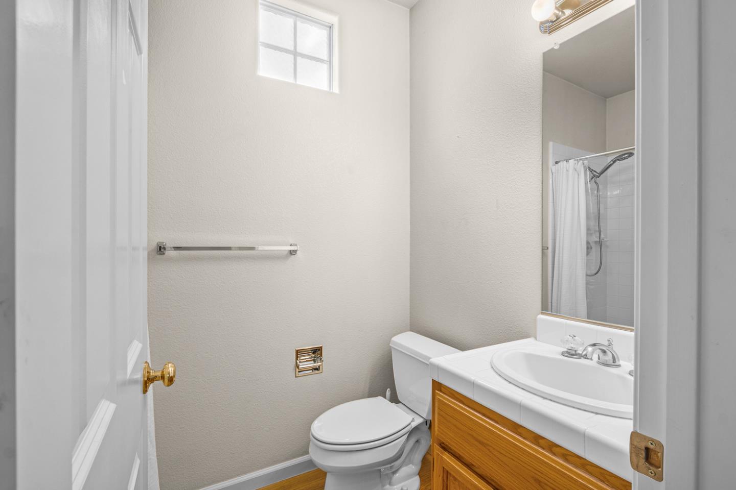 215 Montclair Lane Salinas, CA 93906 - Photo 33 of 40 a bathroom with a sink a toilet and a mirror