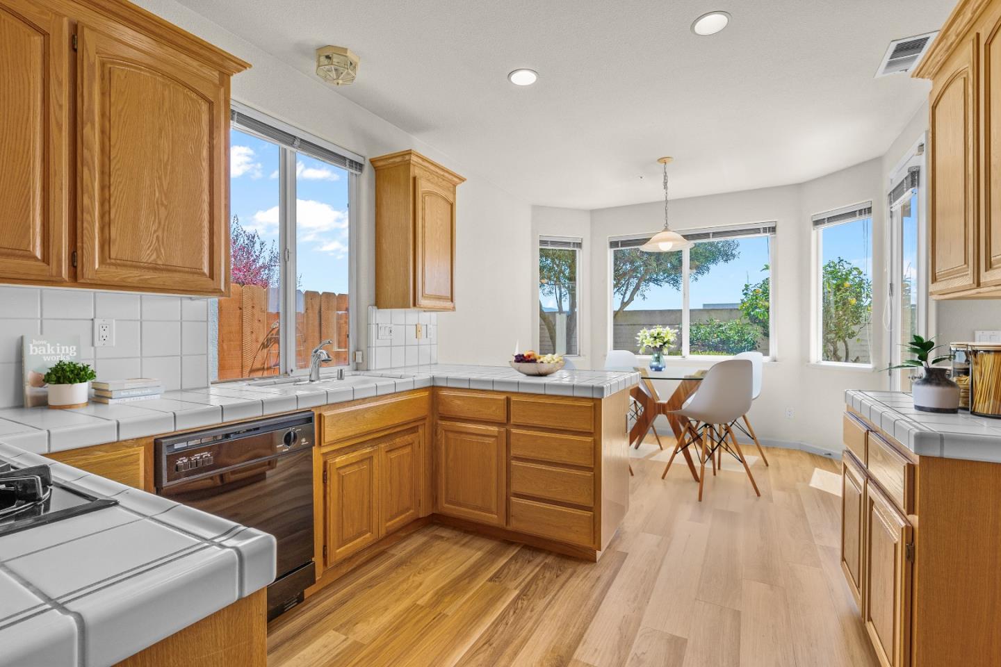 215 Montclair Lane Salinas, CA 93906 - Photo 7 of 40 a kitchen with a sink stove and cabinets