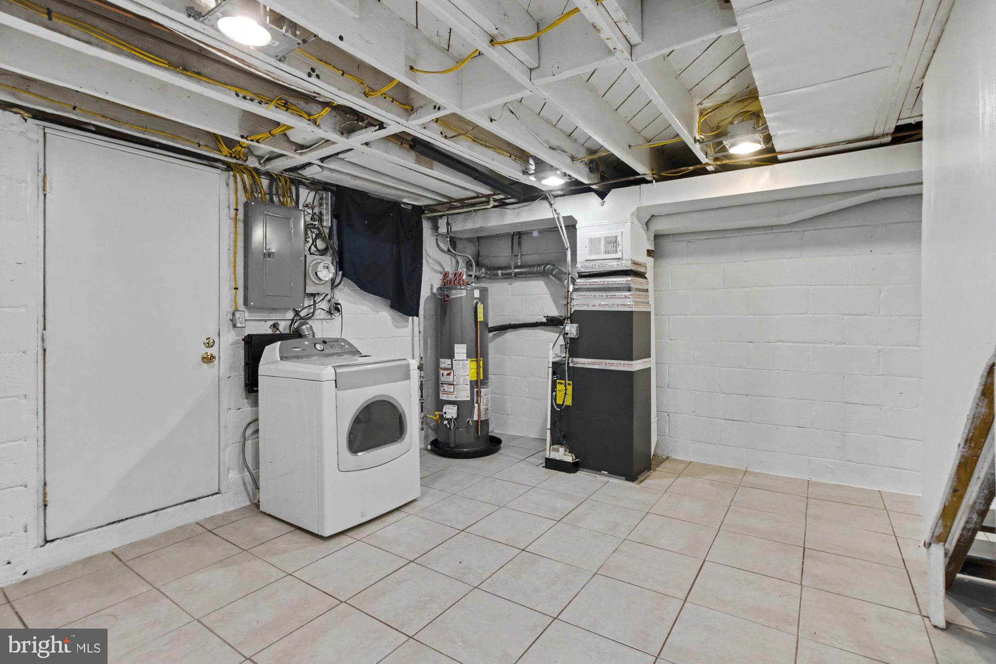 8218 Kavanagh Road Dundalk, MD 21222 - Photo 33 of 39 Spacious basement laundry area.