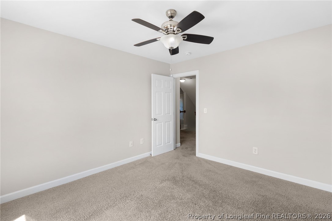 50 Huzzas Circle Cameron, NC 28326 - Photo 24 of 39 an empty room with ceiling fan and window