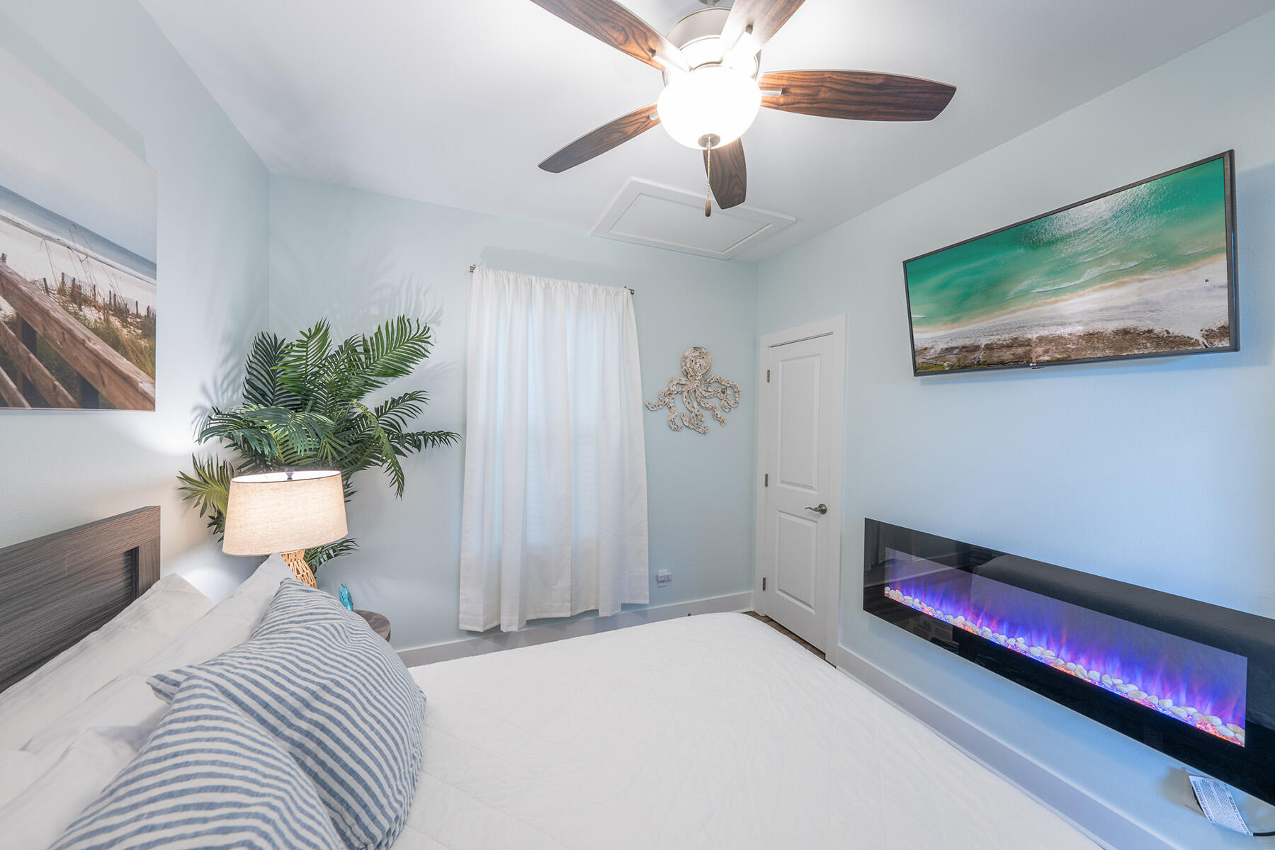 3986 West Hidden Lake Way, Unit 231 Santa Rosa Beach, FL 32459 - Photo 33 of 66 a bedroom with a bed and a chandelier