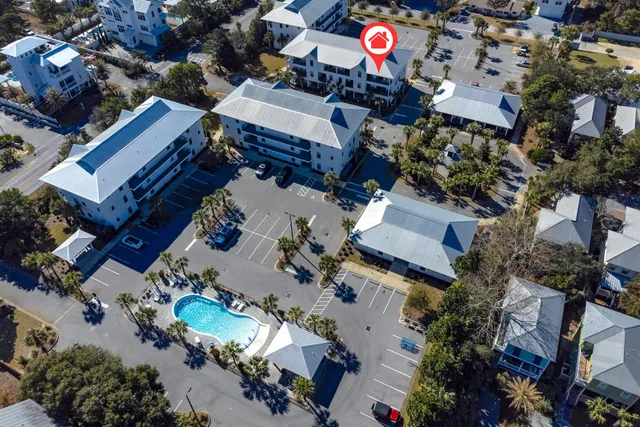 a view of a swimming pool and lounge chairs