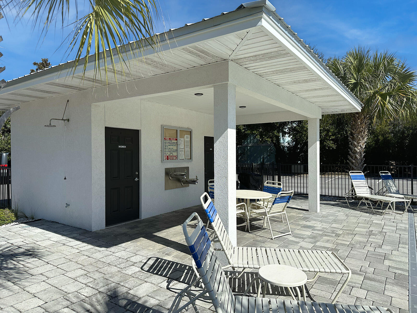 3986 West Hidden Lake Way, Unit 231 Santa Rosa Beach, FL 32459 - Photo 42 of 66 a view of a patio with table and chairs and potted plants