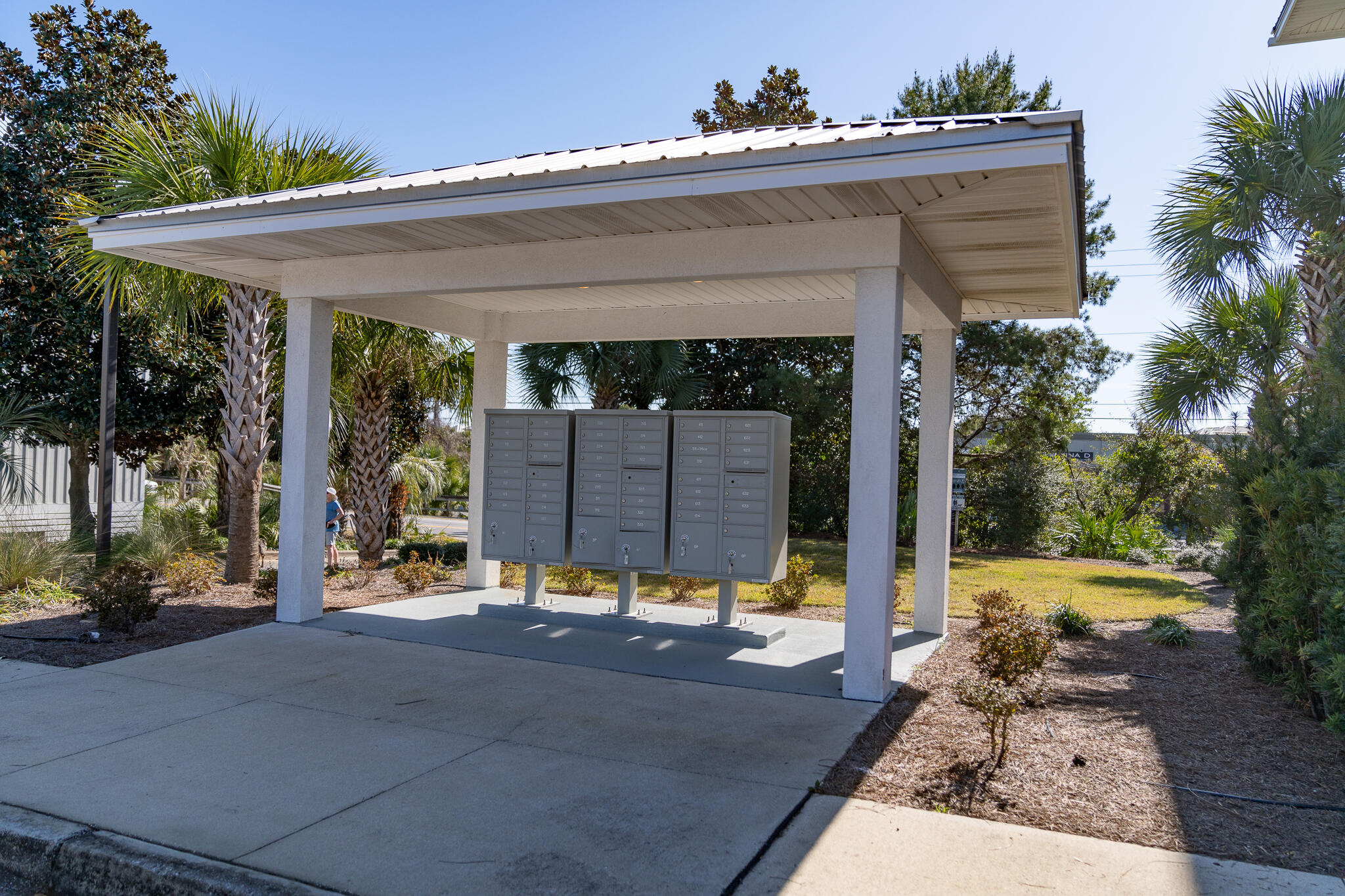 3986 West Hidden Lake Way, Unit 231 Santa Rosa Beach, FL 32459 - Photo 44 of 66 a view of a house with a small yard and potted plants
