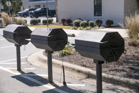 a front view of a house with parking space