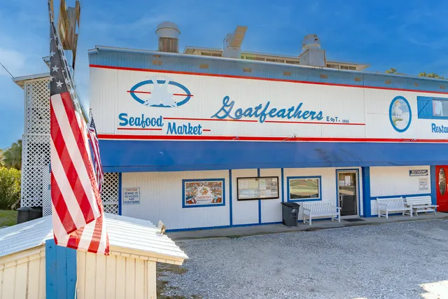 a view of a patio with table and chairs and potted plants
