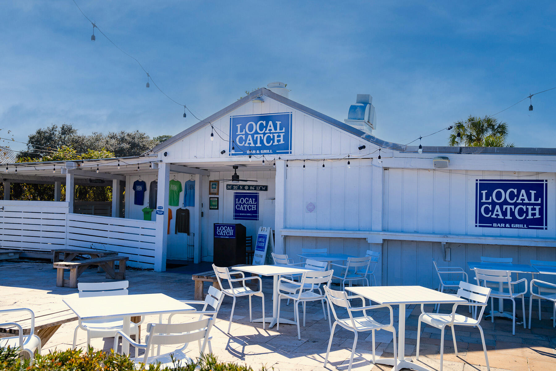 3986 West Hidden Lake Way, Unit 231 Santa Rosa Beach, FL 32459 - Photo 66 of 66 a view of a patio with table and chairs and potted plants