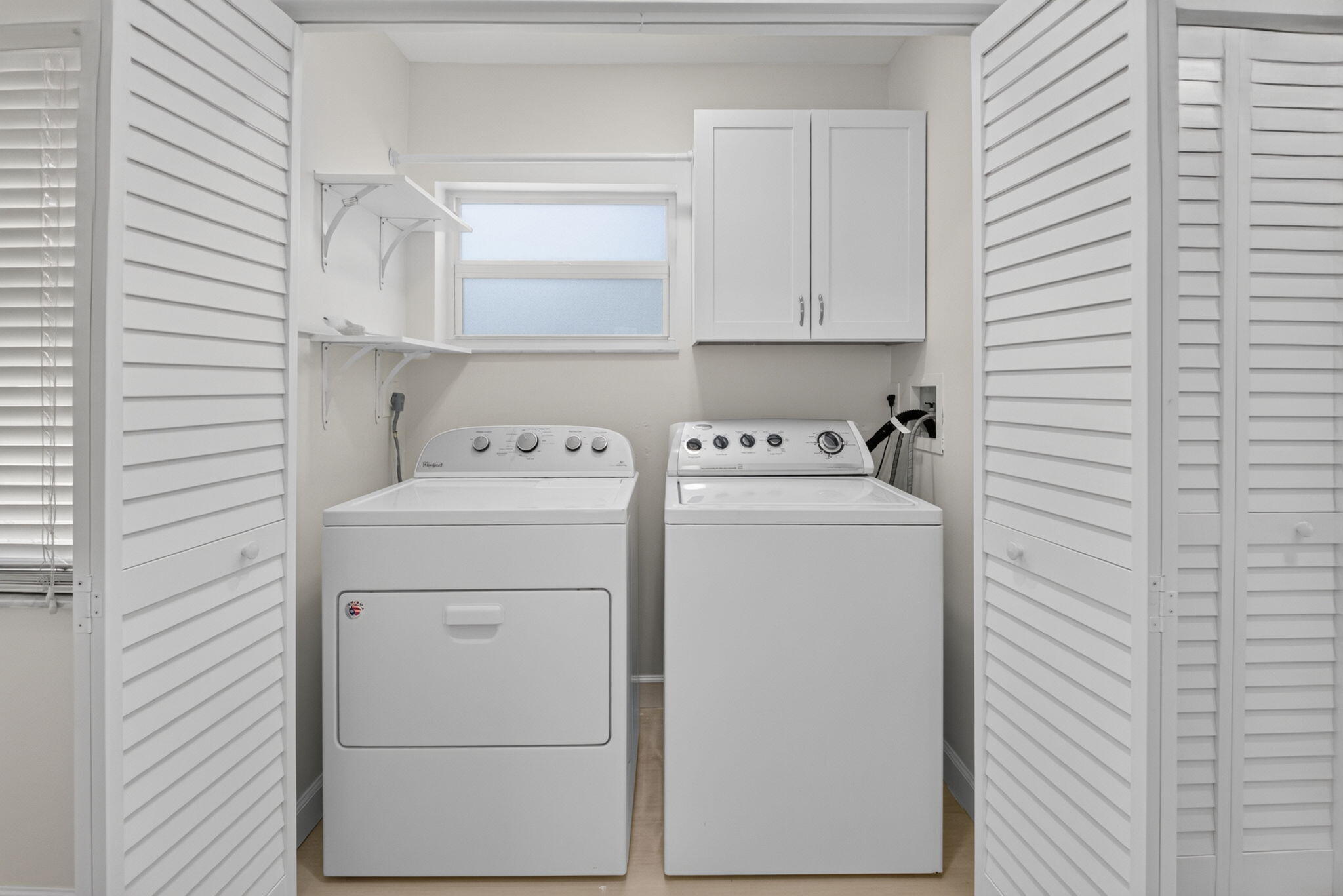 21070 Woodspring Avenue Boca Raton, FL 33428 - Photo 26 of 30 a utility room with dryer and washer