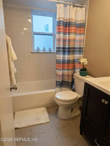a bathroom with a sink toilet and vanity