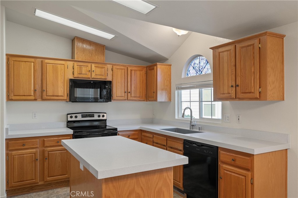 2050 Springfield Drive, Unit 143 Chico, CA 95928 - Photo 12 of 43 a kitchen with stainless steel appliances granite countertop a sink stove and microwave